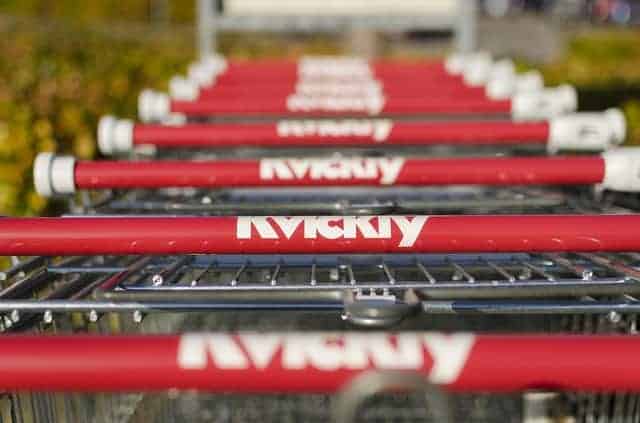 Close-up of grocery carts lined up.